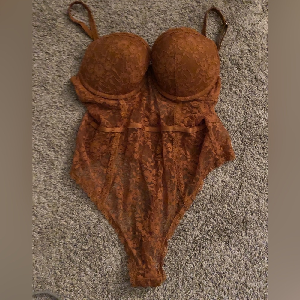 Burnt orange body suit, slightly worn